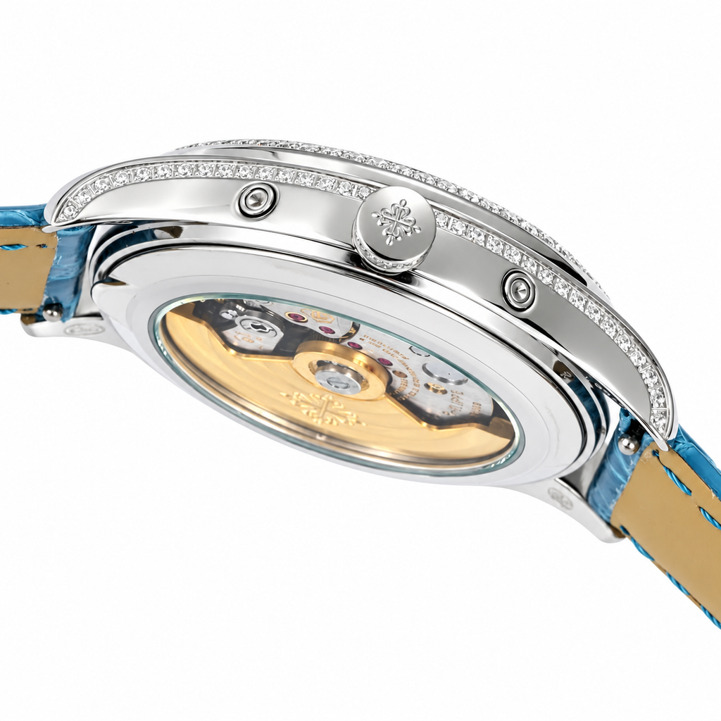 Patek Philippe Ladies Complications White Gold Round Diamond Bezel Blue Dial Arabic Numerals Annual Calendar Moon Phase Date Blue Strap 38mm